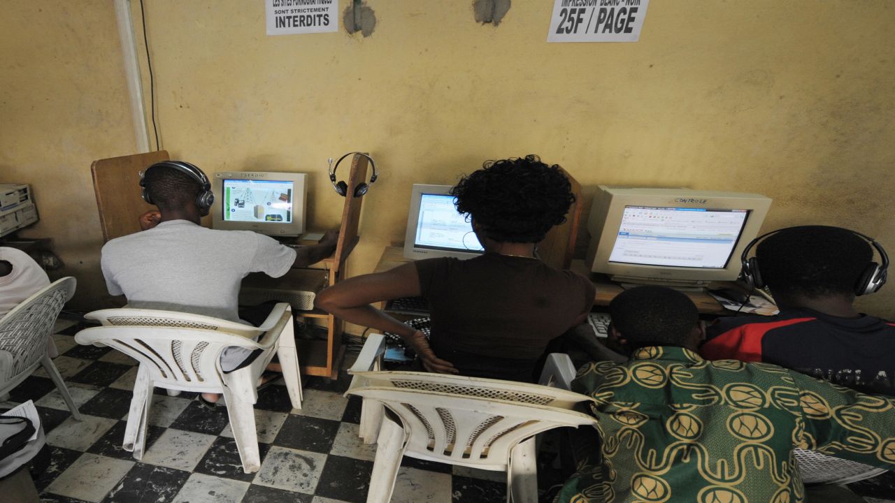 Young Africans browsing the internet in a cybercafe in Ivory Coast. 