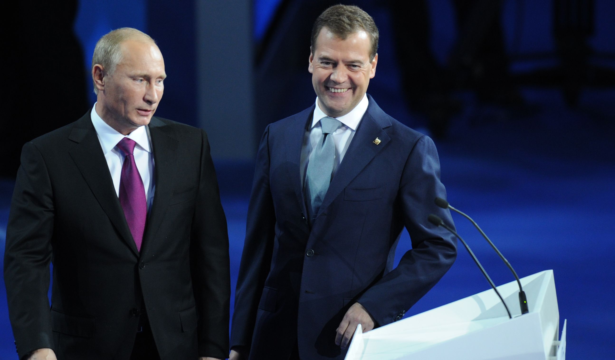 Dmitry Medvedev (R) and Vladimir Putin make a joint appearance at a congress of the United Russia party on September 24.
