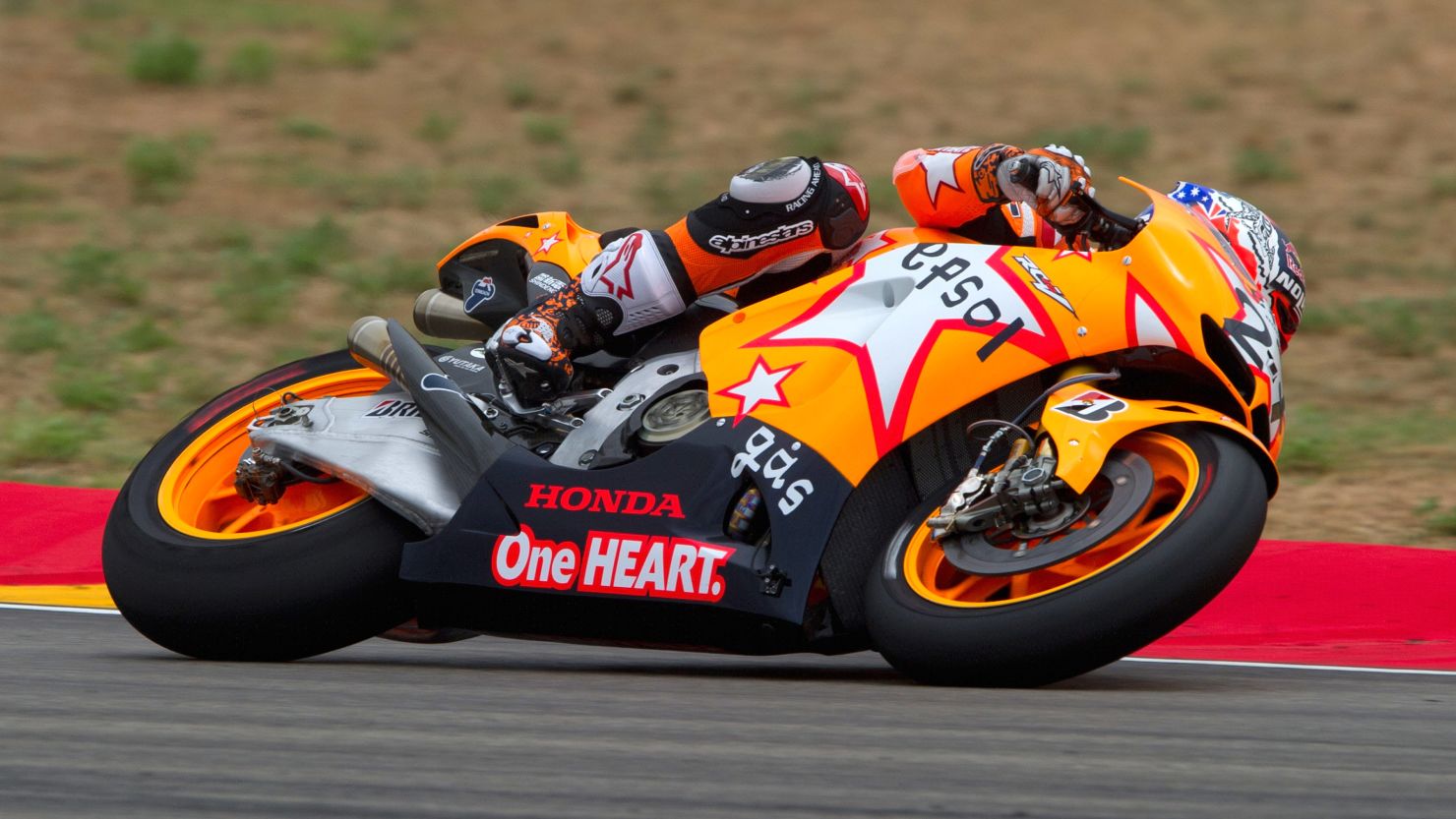Honda rider Casey Stoner is on track to defend his Japan Grand Prix title on Sunday.