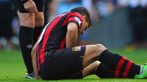 In-form striker Sergio Aguero sits injured during Manchester City's victory at Ewood Park.