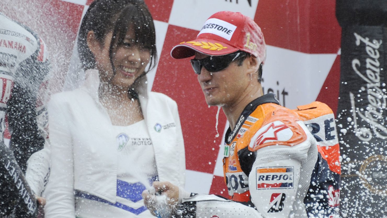 Dani Pedrosa celebrates his victory in the Japanese MotoGP in traditional style