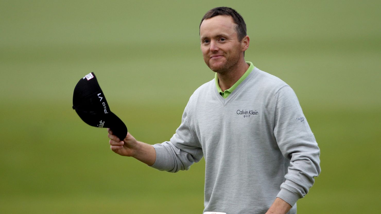 Michael Hoey acknowledges the gallery on the 18th as he seals his triumph at St Andrews 