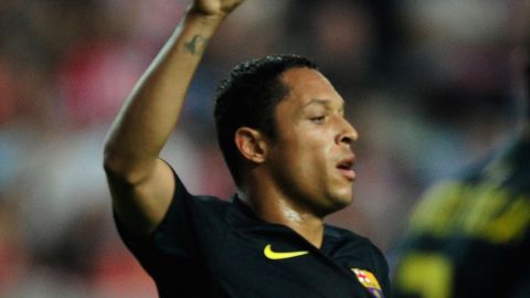 Adriano celebrates the only goal of the match for Barcelona at Sporting Gijon