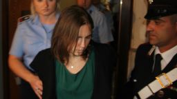 Amanda Knox enters a court in Perugia, Italy, on the final day of her appeal against her conviction for murdering her British roommate Meredith Kercher four years ago