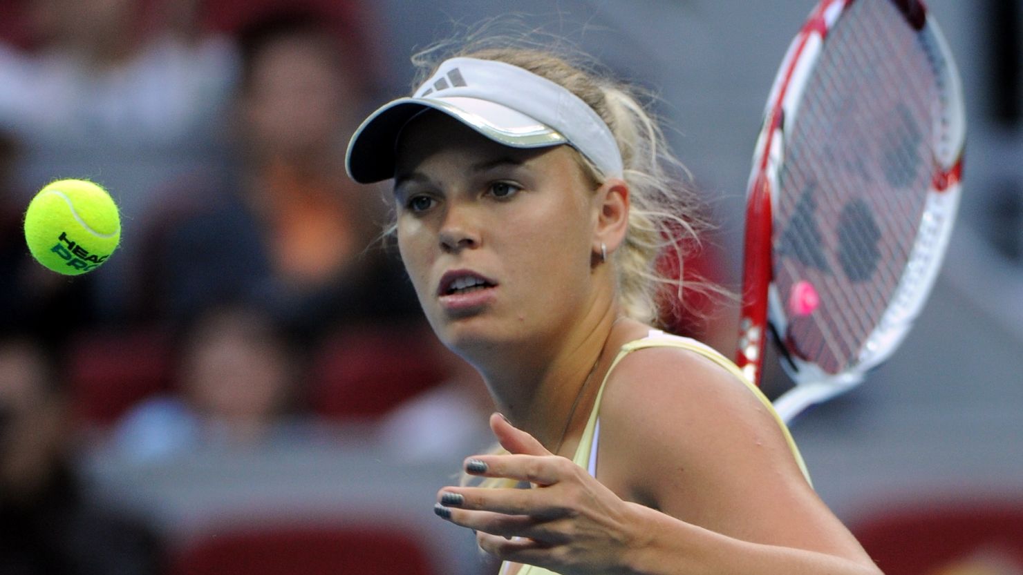 Caroline Wozniacki was extended to three sets before going through in the China Open 