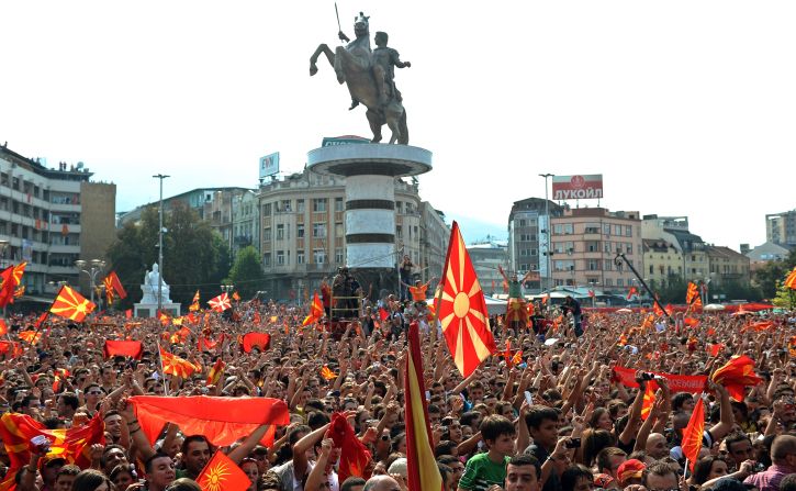 Crowds celebrate the European success of the Macedonian national basketball team in front of the new Warrior on a Horse statue in Skopje's main square.