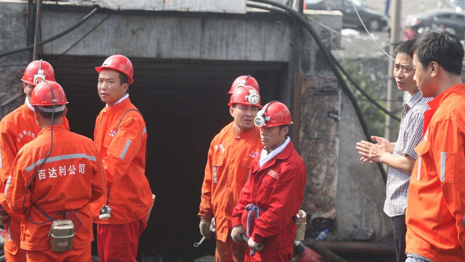 Rescuers prepare to enter a coal pit to rescue trapped workers in Hengtai coal mine on August 24, 2011 in Qitaihe, China.