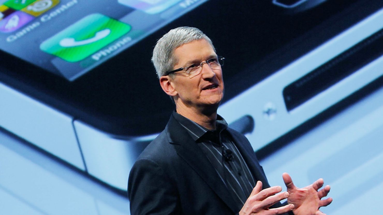 Apple CEO Tim Cook helps unveil the Verizon iPhone in January in New York.