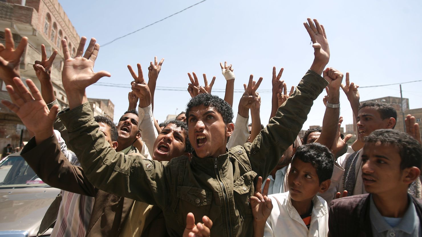 Yemeni anti-regime protesters chant slogans during a demonstration in Sanaa on October 2, 2011.
