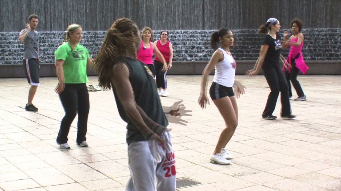 People take part in a Zumba class in an Atlanta park.