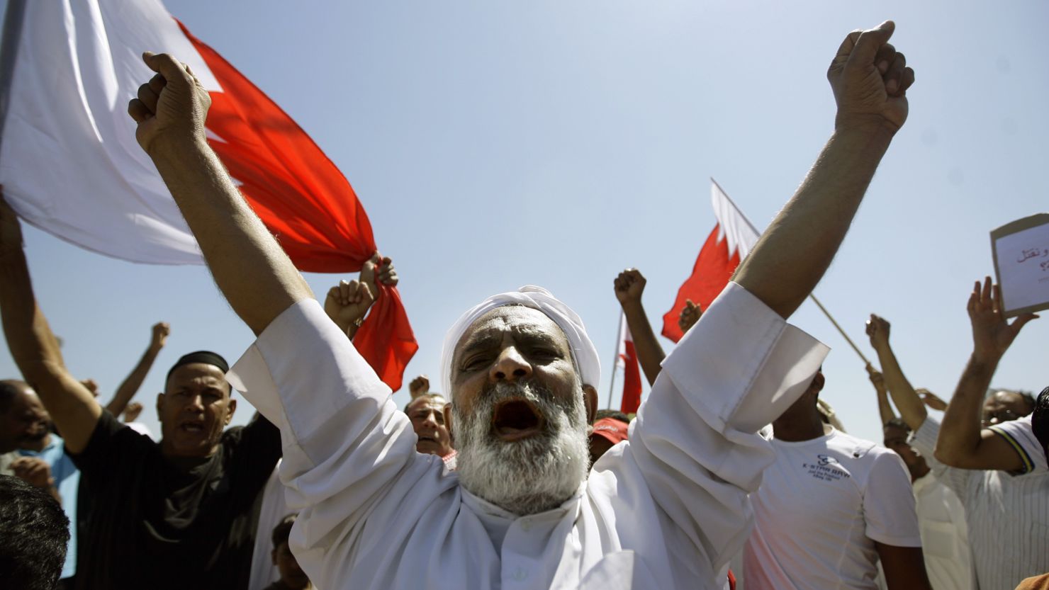 Bahraini Shiite mourners chant slogans during the funeral of a man killed during anti-government demonstrators in March. 