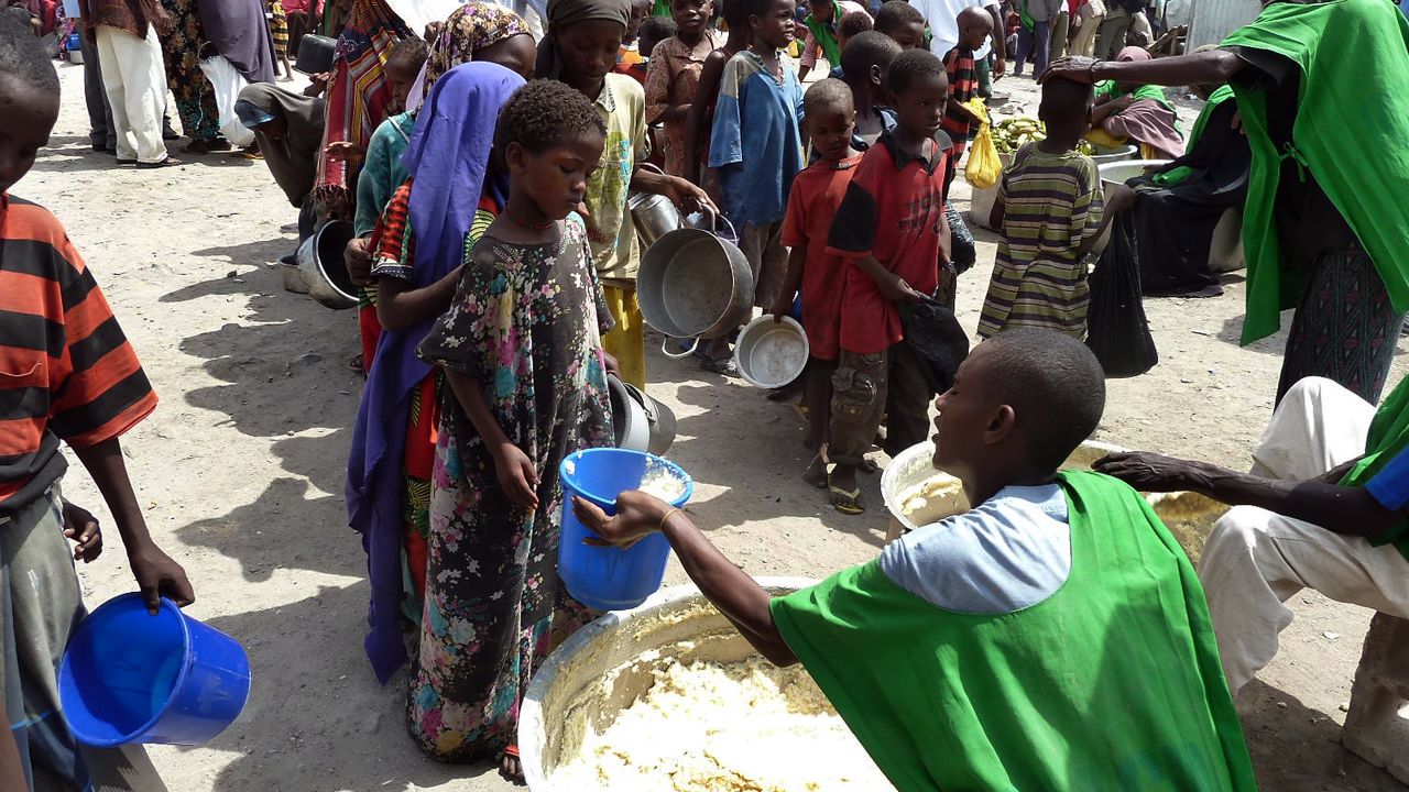 Children receiving food at a WFP-feeding centre in Somalia's capital Mogadishu in September. 