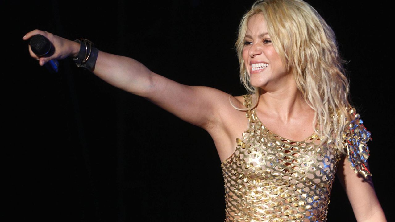 Shakira shows off plenty of skin on the "Live from Paris" combo-pack album/DVD.