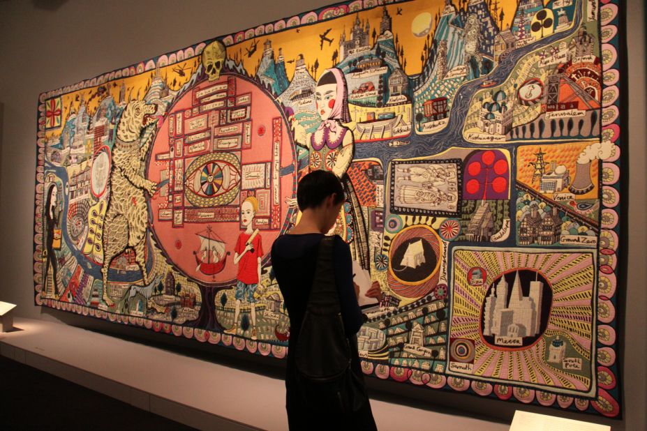 The massive tapestry "Map of Truths and Beliefs" features pilgrimage destinations -- both religious and secular.