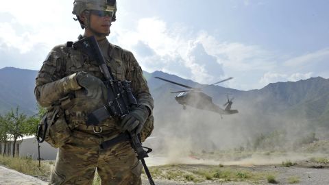 A U.S. soldier secures a landing zone for a Black Hawk helicopter in the Shigal district center in Kunar province, Afghanistan.