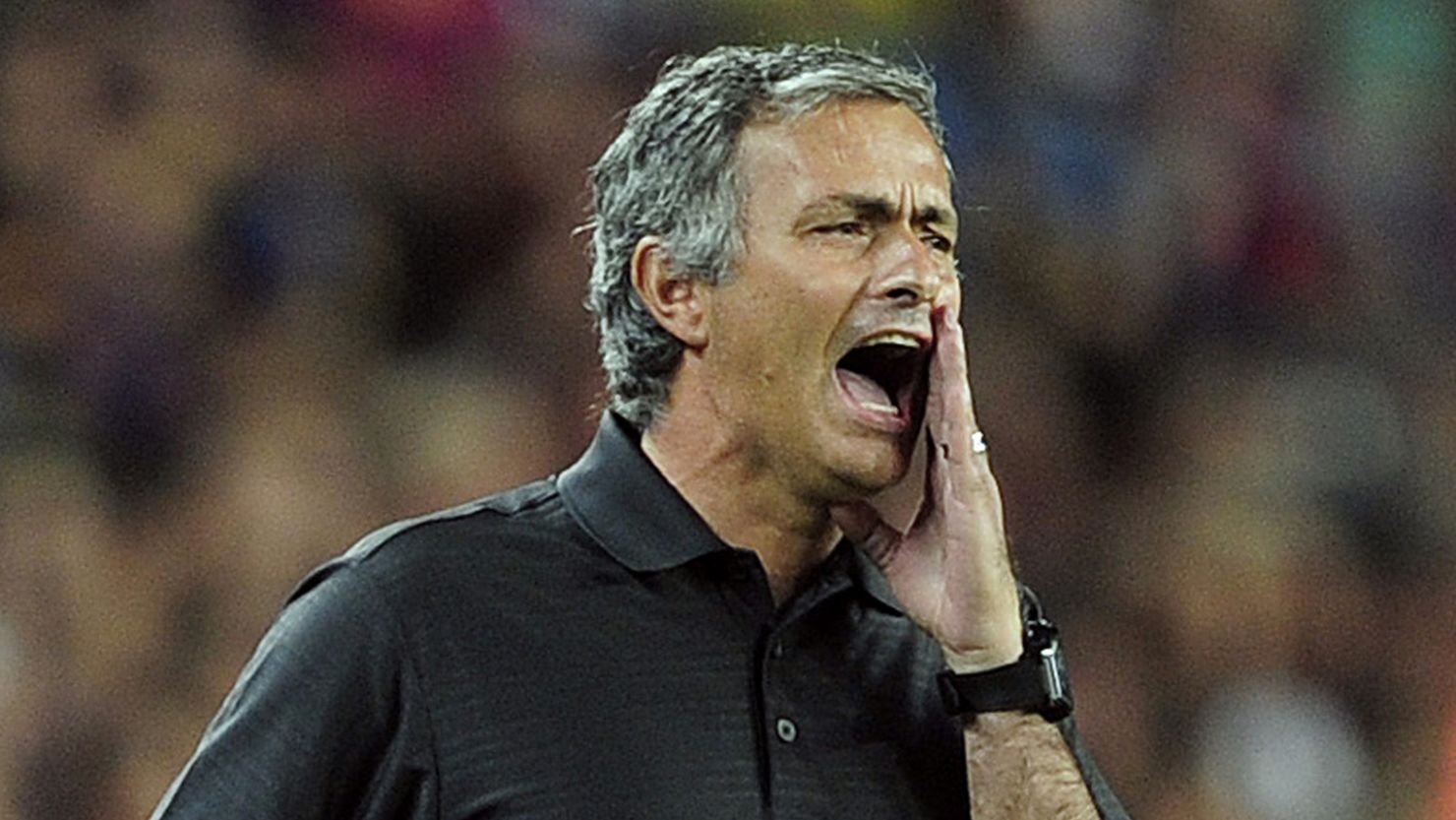 Real Madrid coach Jose Mourinho shouts during the second leg of the Spanish Super Cup at Barcelona's Camp Nou.
