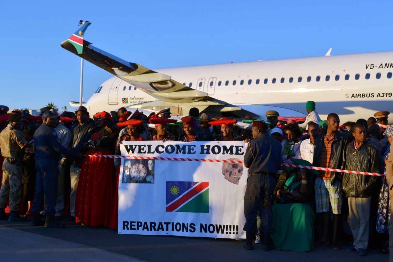 Thousands flocked to Namibia's Hosea Kutako International Airport Tuesday, praying, singing and chanting as the 20 skulls were returned to the country.