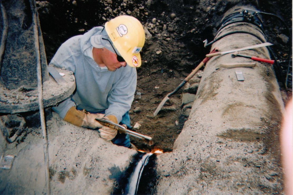 Pipeline welder Cody Pedigo works on a 2005 job in Farmington, New Mexico.