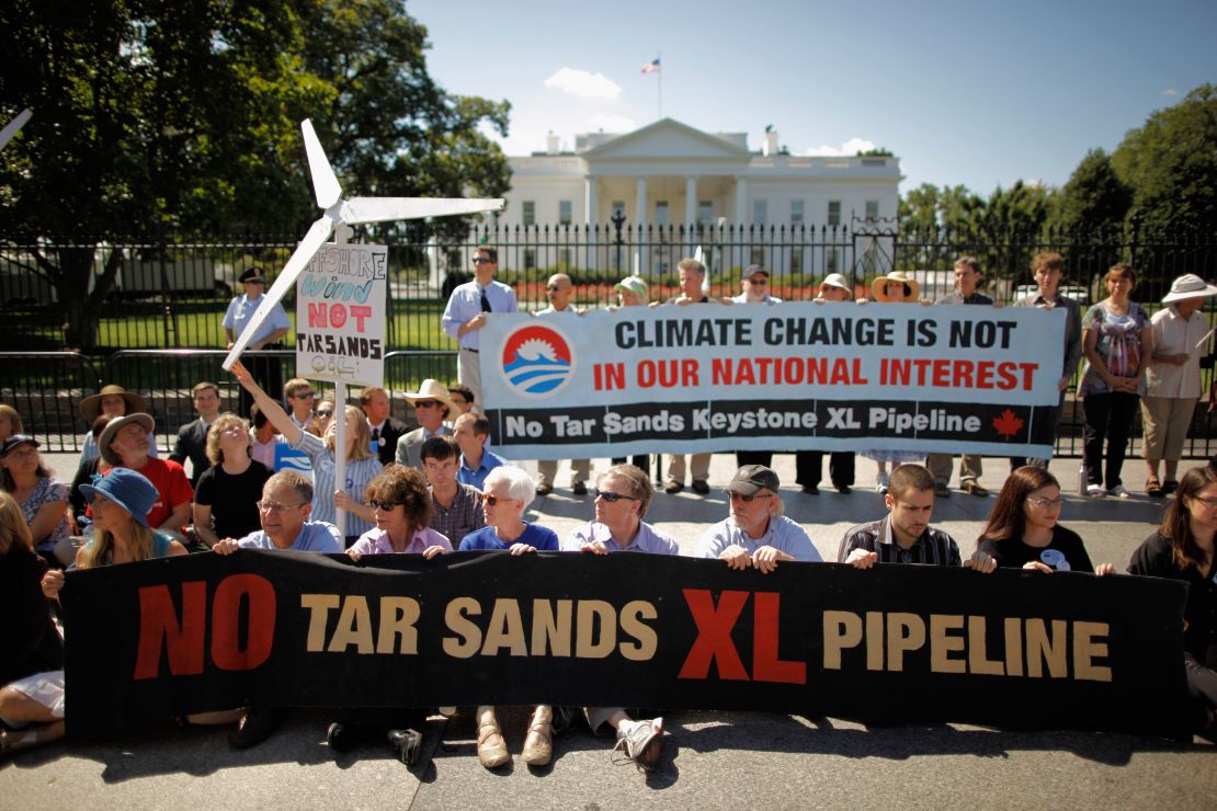 Demonstrators stage a White House sit-in protest in August calling on the president to block construction of an oil pipeline.
