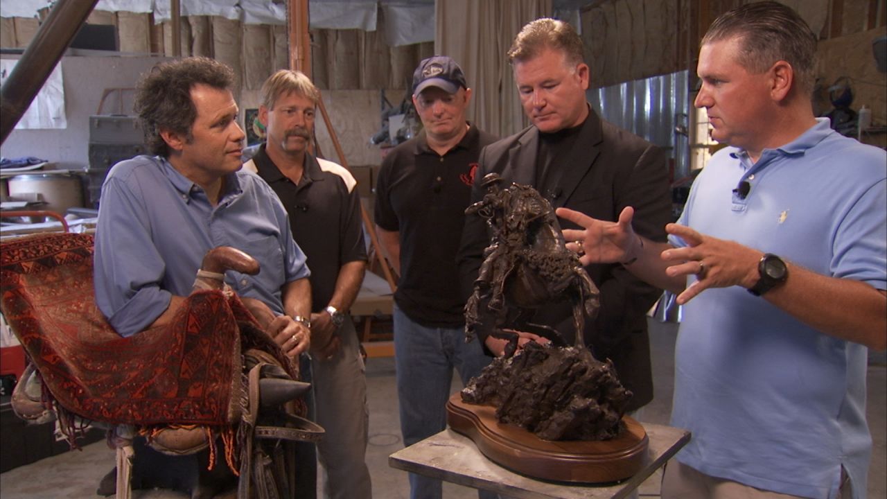 Former special operations forces tell sculptor Douwe Blumberg, left, about their mission in his Kentucky studio.