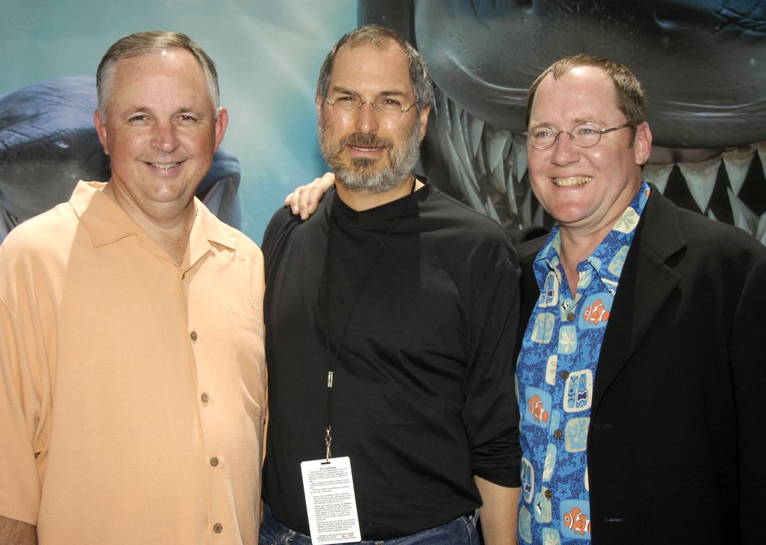 Disney's Dick Cook, <a href="http://www.cnn.com/specials/tech/steve-jobs-the-man-in-the-machine">Jobs</a> and producer John Lasseter pose for photographers at the premiere of "Finding Nemo" in Hollywood on May 18, 2003. 