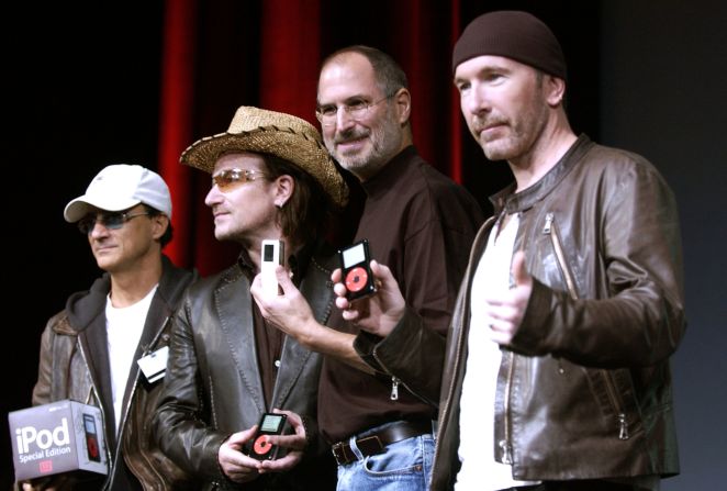 <a href="http://www.cnn.com/specials/tech/steve-jobs-the-man-in-the-machine">Jobs</a> laughs with Jimmy Iovine, from left, Bono and The Edge of U2 at a celebration of the release of new iPod products in October 2004 in San Jose, California. 
