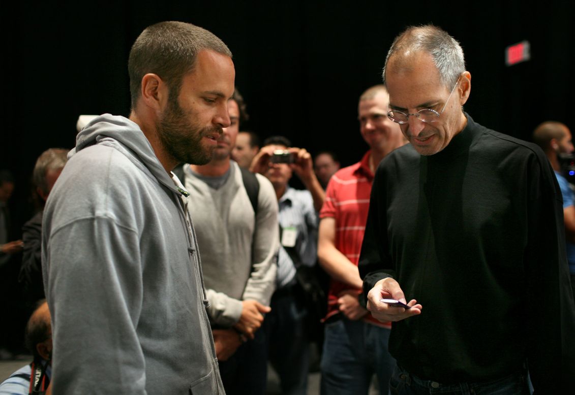 Musician Jack Johnson, left, talks with <a href="http://www.cnn.com/specials/tech/steve-jobs-the-man-in-the-machine">Jobs</a> during an Apple special event in 2008 where a new version of the iPod Nano and Touch were announced.