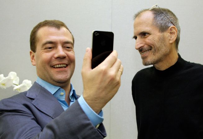 Russian President Dmitry Medvedev, left, admires his new iPhone 4 from <a href="http://www.cnn.com/specials/tech/steve-jobs-the-man-in-the-machine">Jobs</a> on Medvedev's tour of Silicon Valley in June 2010.