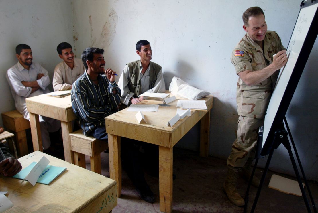 United States army Lt. Col. Ed Dorman from Cookville teaches his first English class in a school near the Bagram Air Base in Afghanistan, April 2002. 