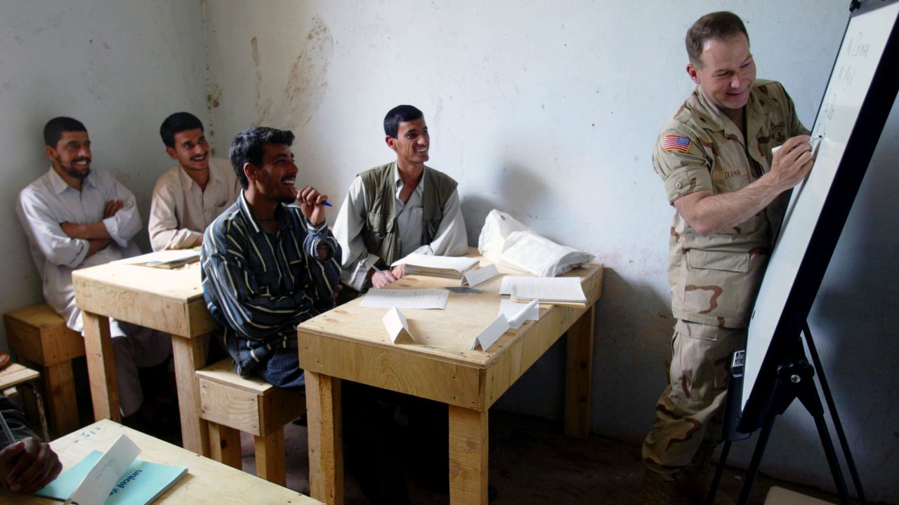 United States army Lt. Col. Ed Dorman from Cookville teaches his first English class in a school near the Bagram Air Base in Afghanistan, April 2002. 