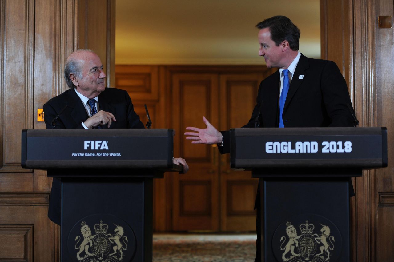 "It is a sad day for football," FIFA president Sepp Blatter, pictured here meeting British Prime Minister David Cameron a week earlier, tells reporters in Zurich. 