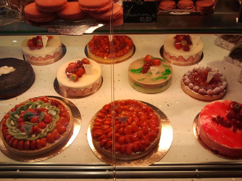 Tempting cakes for sale at the bakery on Rue Cler.