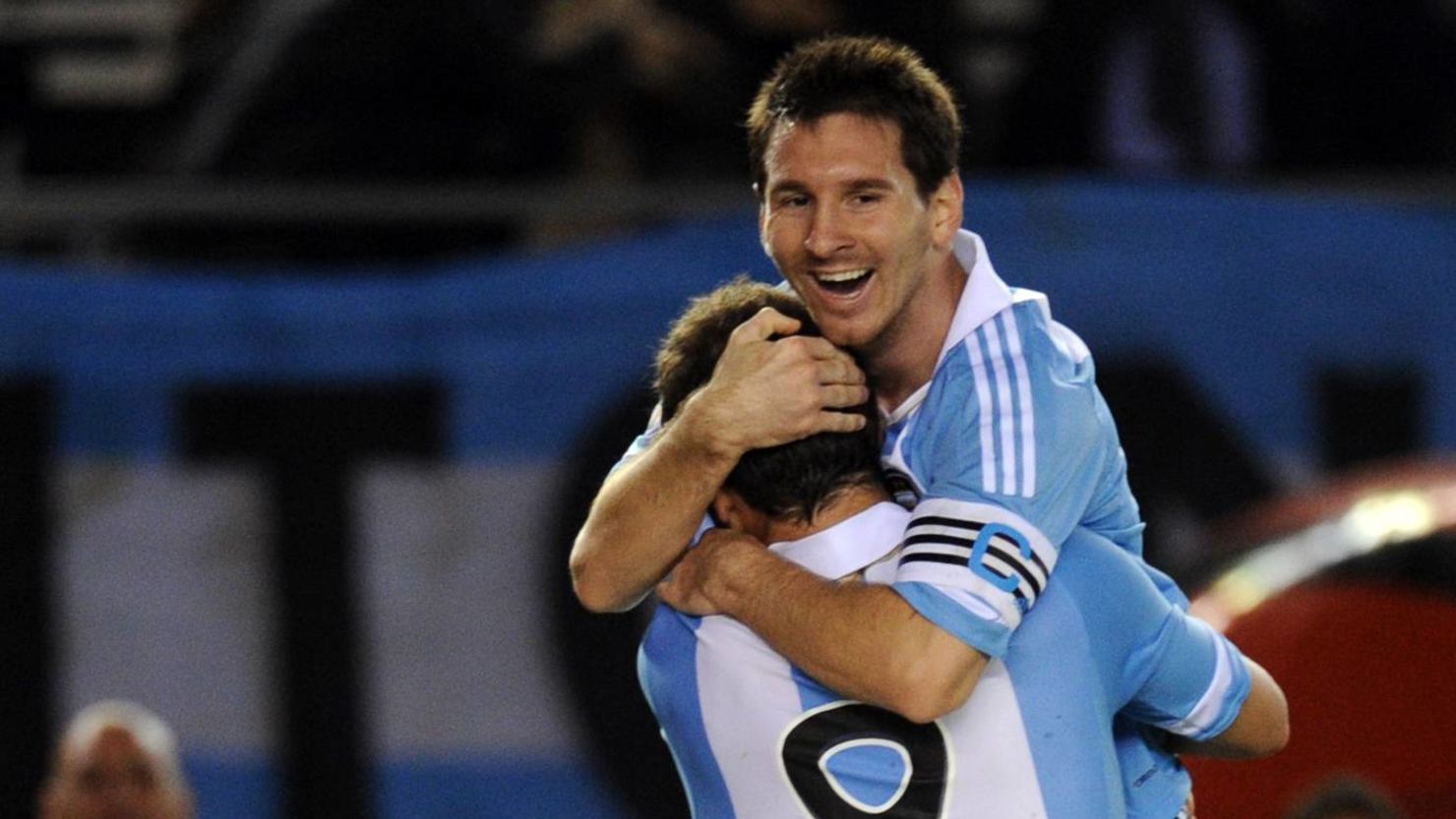 Argentina's Gonzalo Higuain (front) and teammate Lionel Messi celebrate after the home team's fourth goal against Chile.