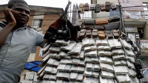 A vendor of mobile phones in Lagos, Nigeria, in April 2007. The cost of cell phones have dropped in the past decade, which saw mobile subscriptions grow to 4 billion in the developing world.