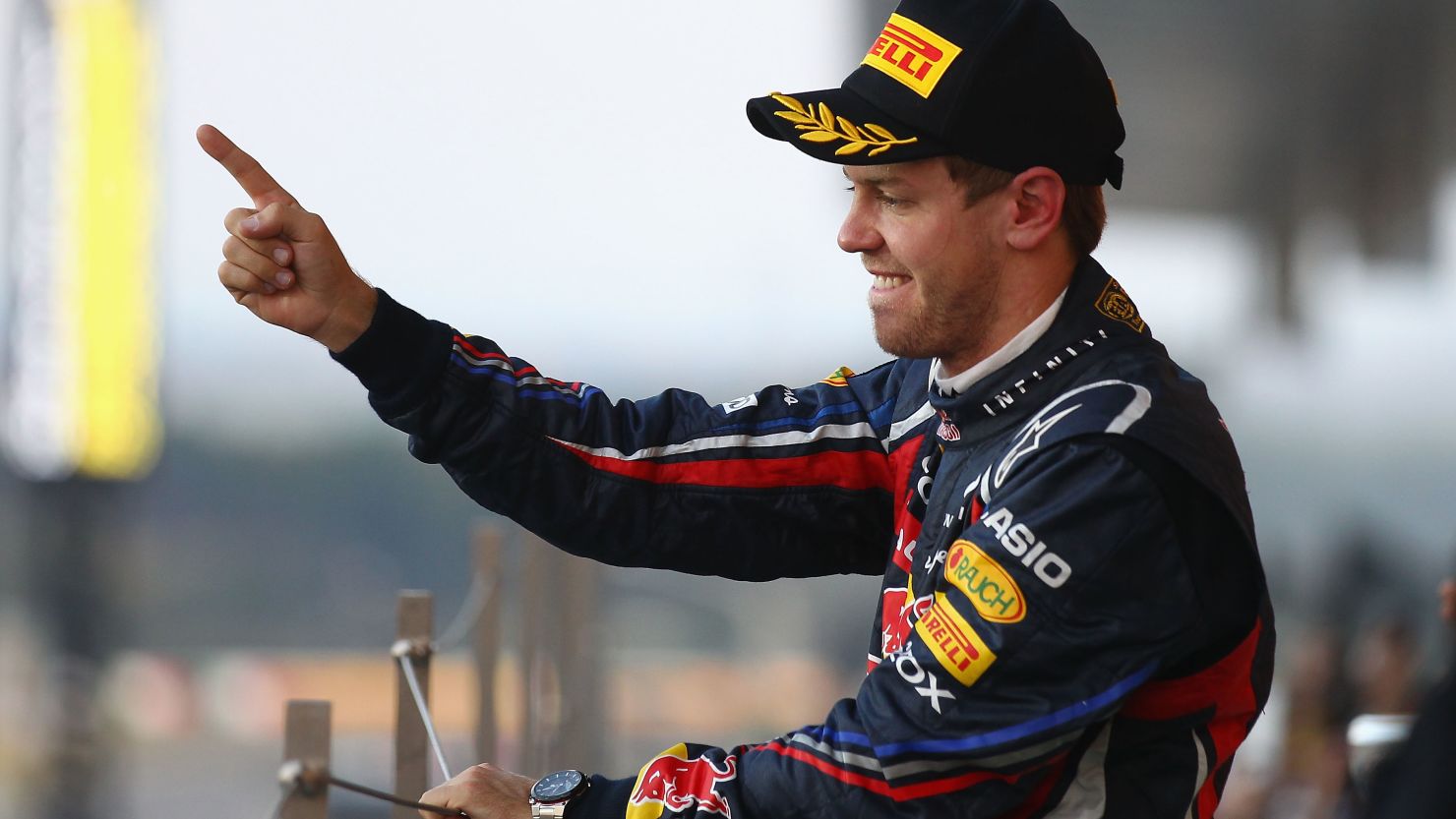 Sebastian Vettel stands on the Suzuka podium after making Formula One history.