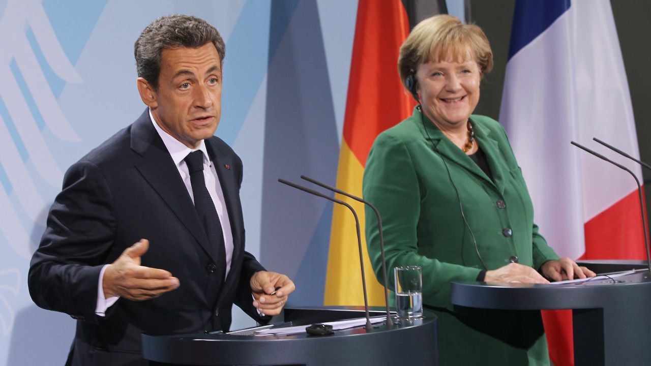French President Nicolas Sarkozy and German Chancellor Angela Merkel speak to the media after meeting in Berlin on Sunday, October 9.