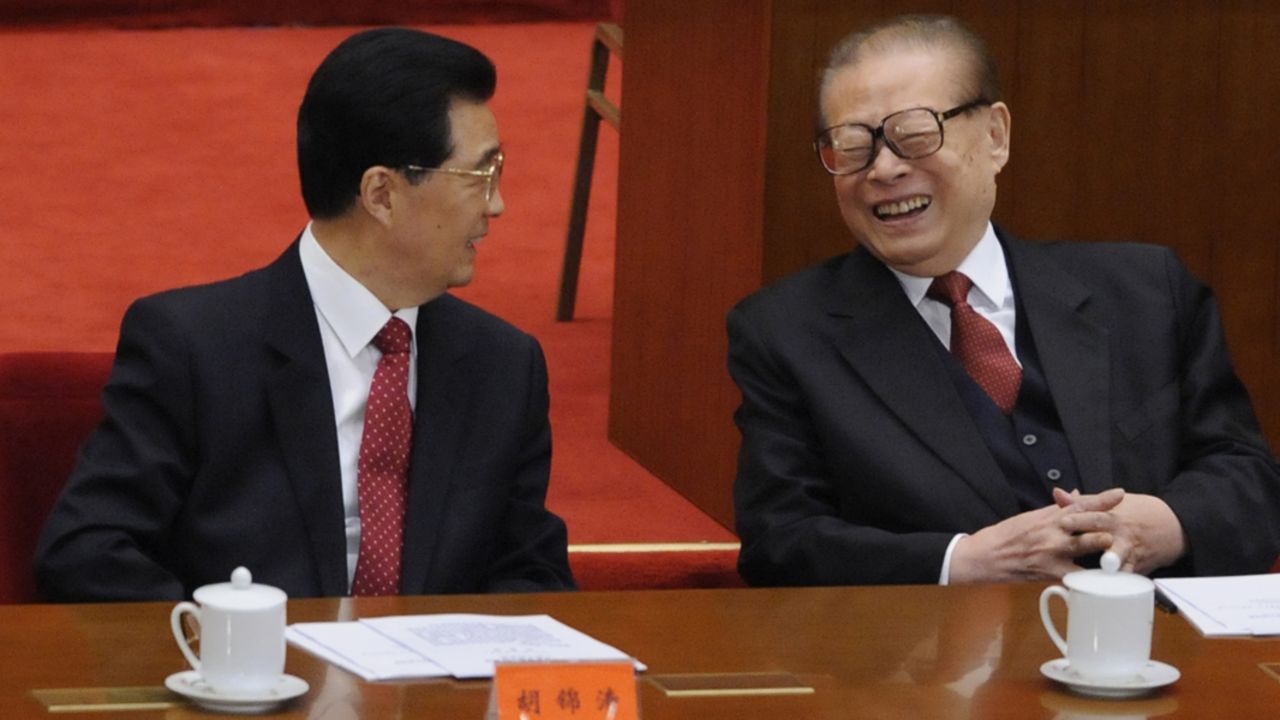 Former Chinese President Jiang Zemin, right, sits with President Hu Jintao at the ceremony on Sunday.   