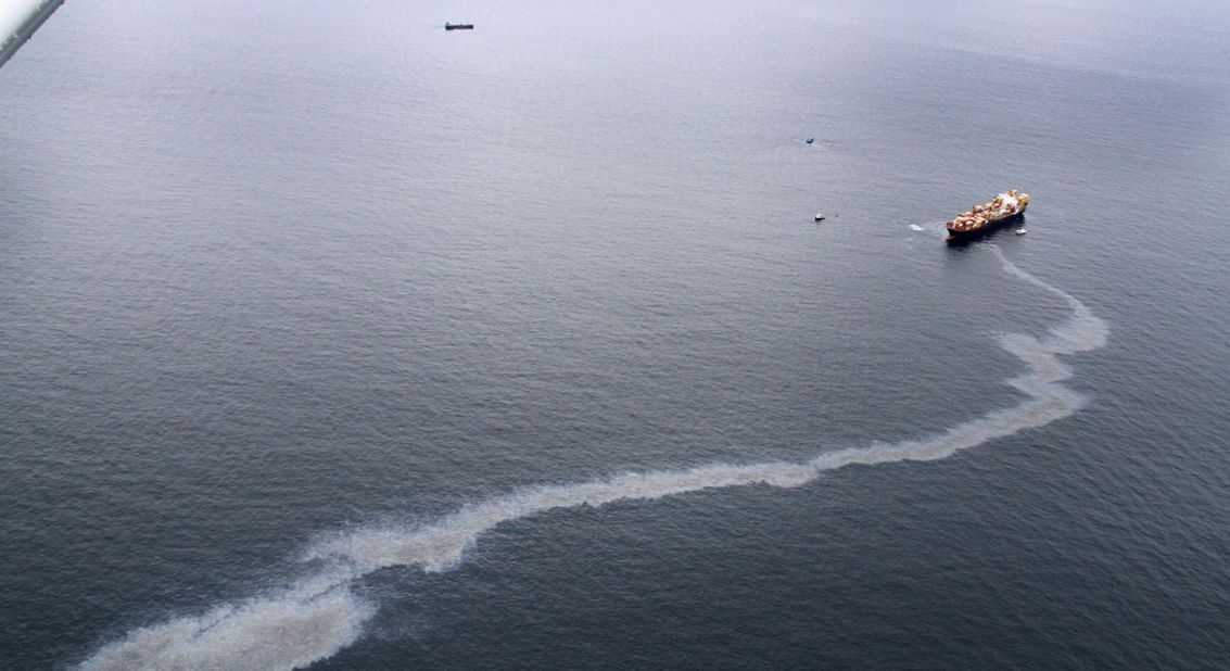 An oil slick is seen coming from the Rena on October 9. 