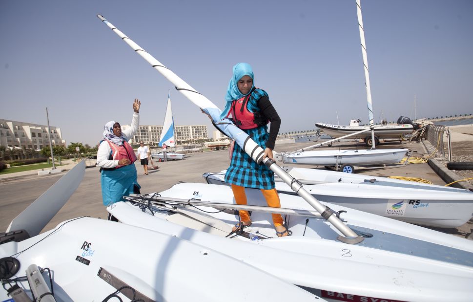 Trainee female sailors prepare their boats for sailing during a training session in Massanah in Oman. 