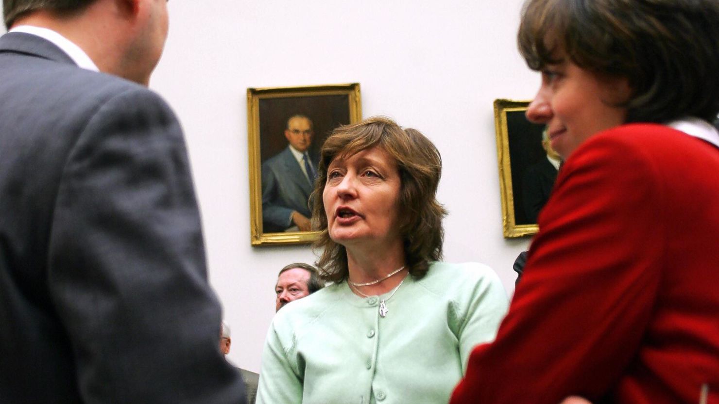 Geraldine Finucane (C), wife of slain Irish human rights attorney Patrick Finucane, speaks with collegues 16 March, 2005 in Washington D.C.