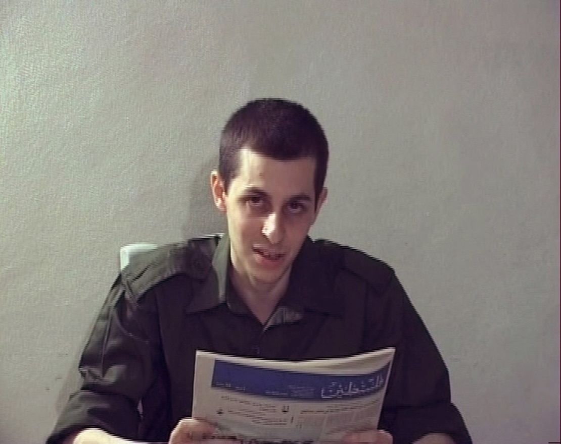 In a Hamas video, Israeli soldier Gilad Shalit is seen holding a Palestinian newspaper.