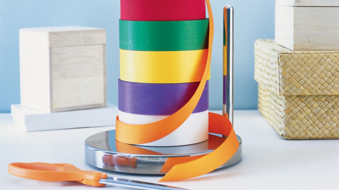 No more knots to untie when it comes time to dress a present with ribbon -- just use a paper towel holder.