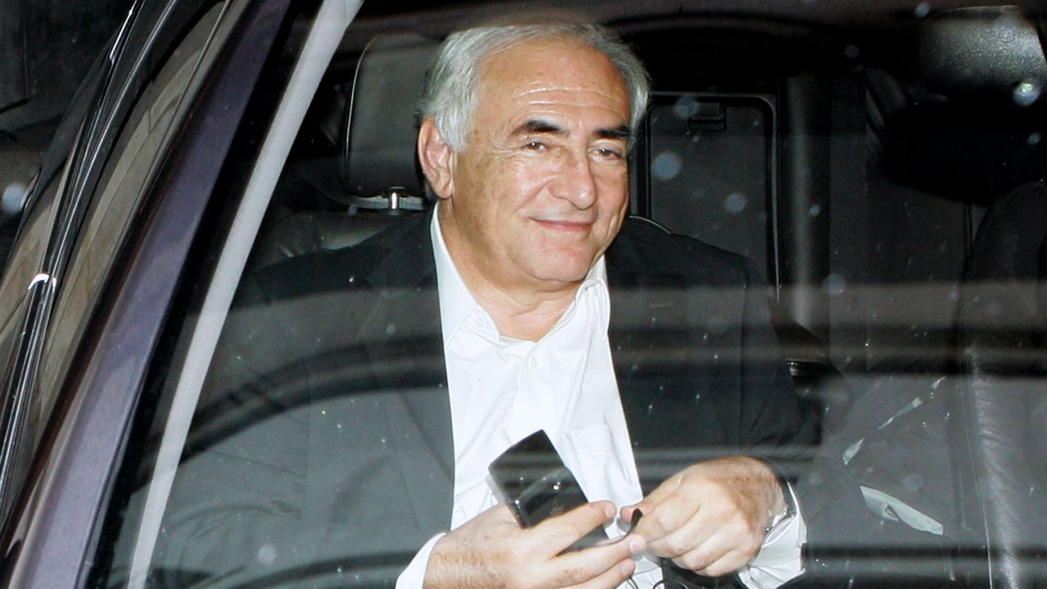 Dominique Strauss-Kahn travels to his lawyer's offices to be questioned by police on September 12, in Paris, France.