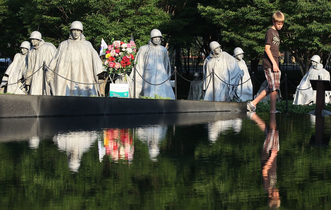The Korean War Veterans Memorial honors all of the American services and includes statues of figures in uniforms representing each branch.