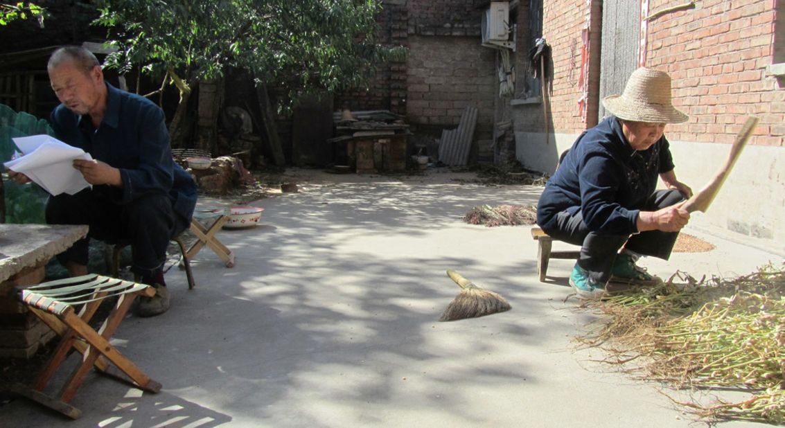 Zhang's husband (left), crushed by their son's execution, tried to commit suicide and later became half-paralyzed.