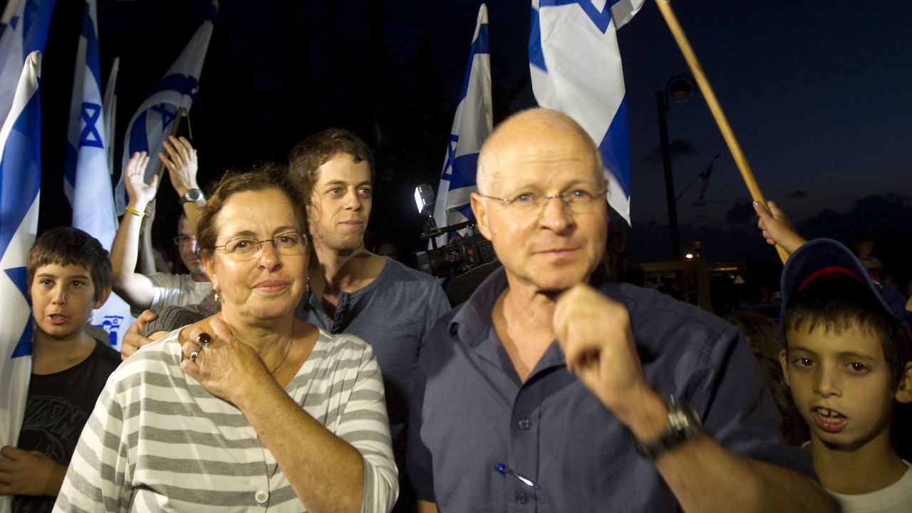 Aviva and Noam Shalit are surrounded by supporters at their home after news of the deal that would free their son.
