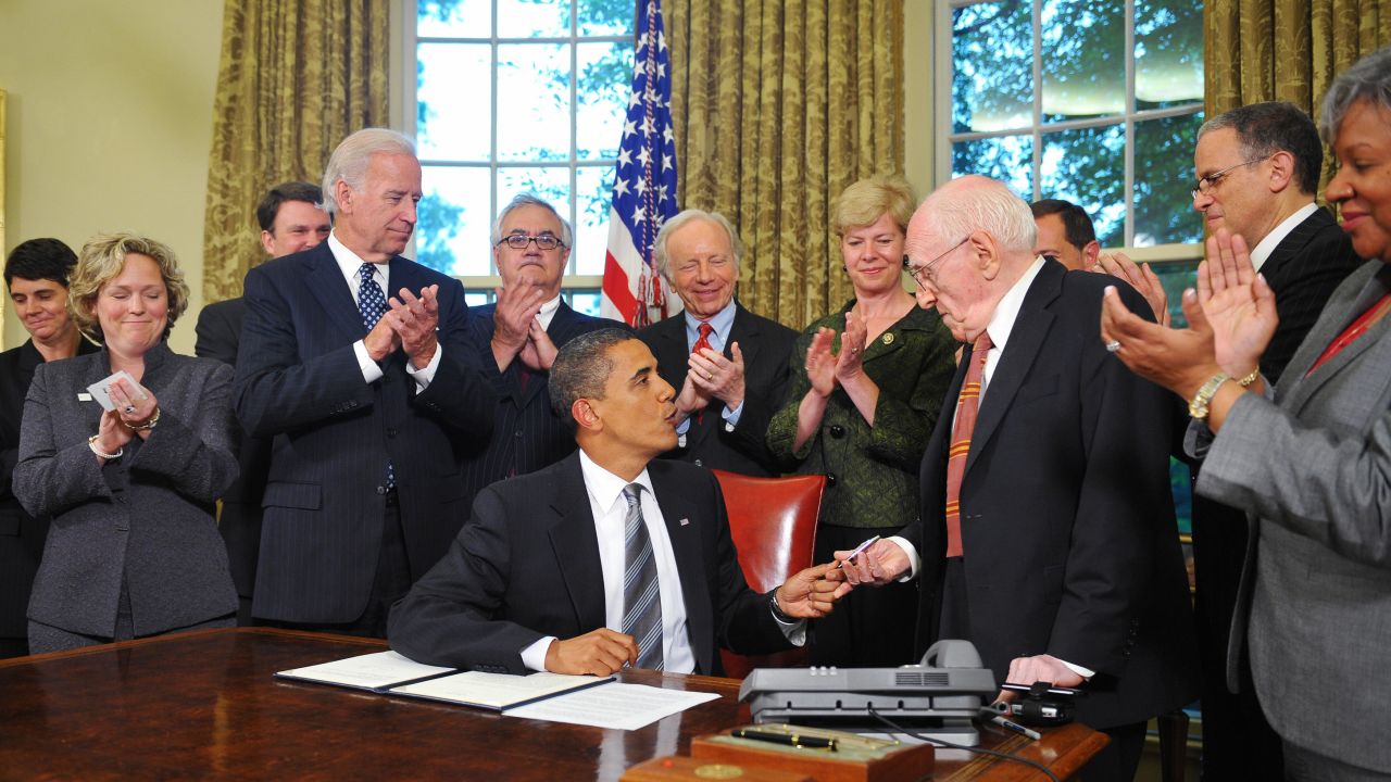 Frank Kameny receives a pen President Obama used to sign a memorandum regarding non-discrimination June 17, 2009.