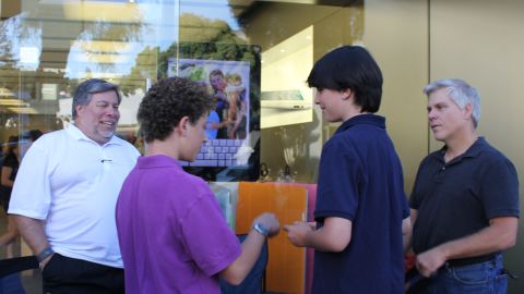 Fans gathered around Steve Wozniak to chat briefly with the computer legend.