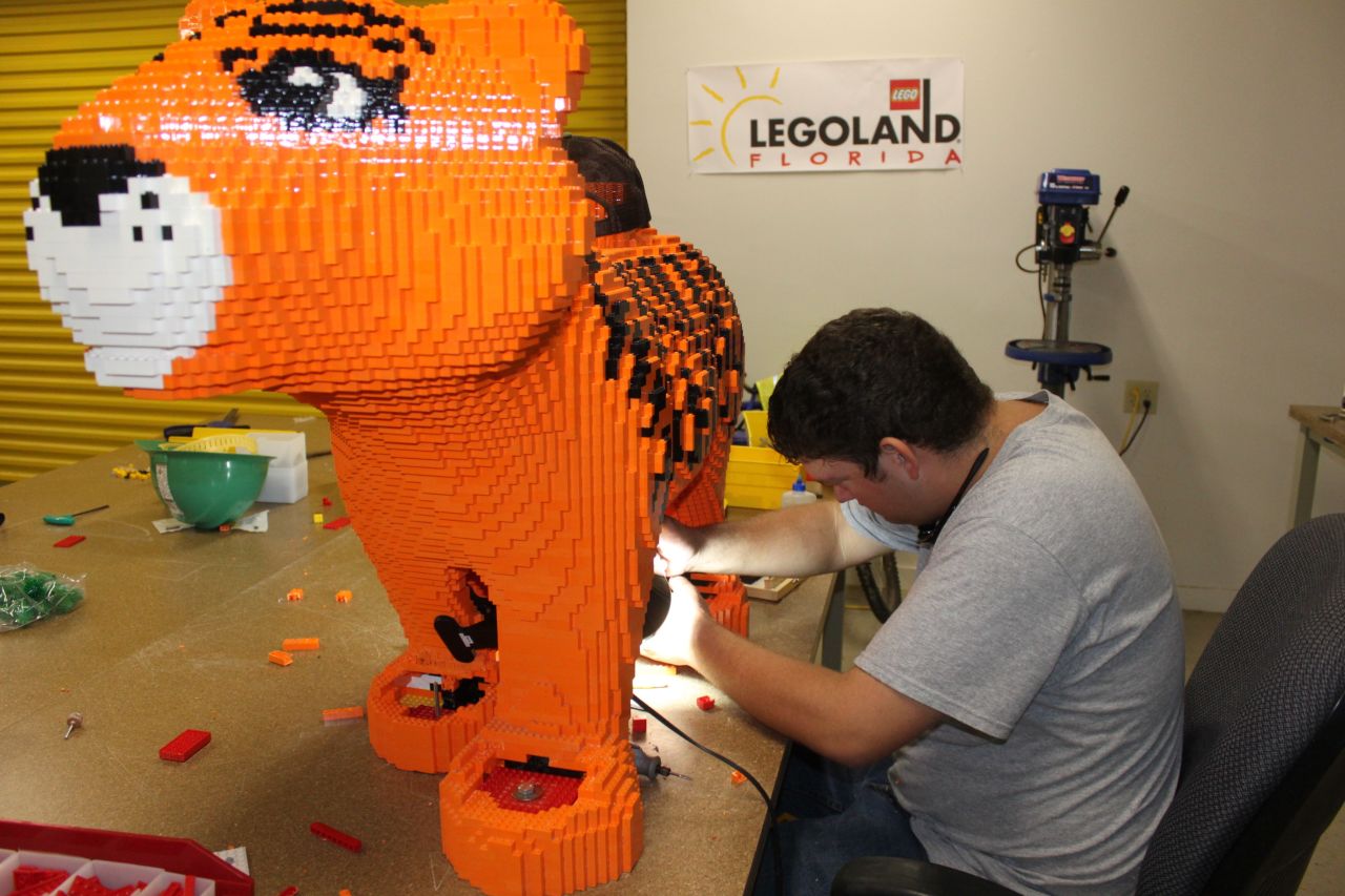 Legoland figures are designed by computers, but each figure is hand-built using the same Lego parts available to the public. 
