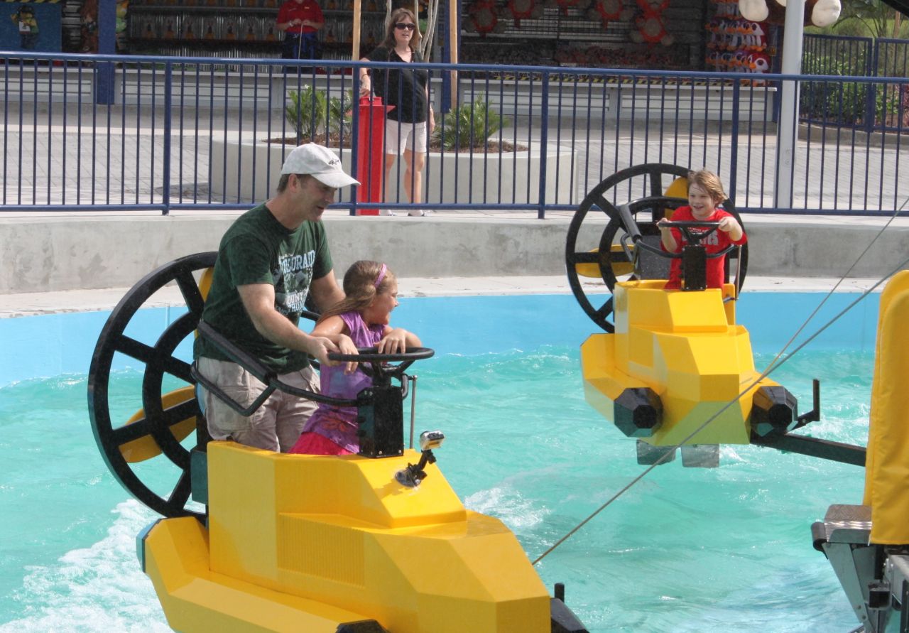 Park-goers try out a Legoland ride during a preview visit.